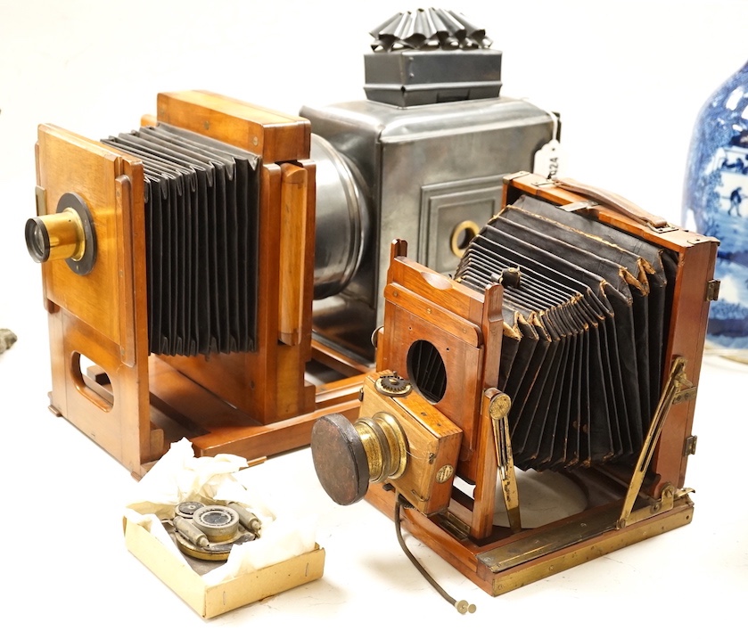An early 20th magic lantern and a bellows camera, Magic lantern 51 cms wide.